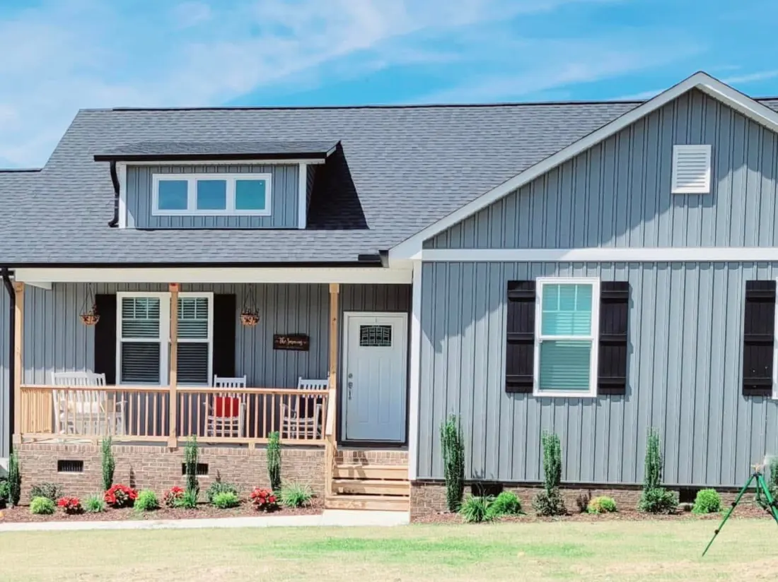 Front beds and lawn at a blue house